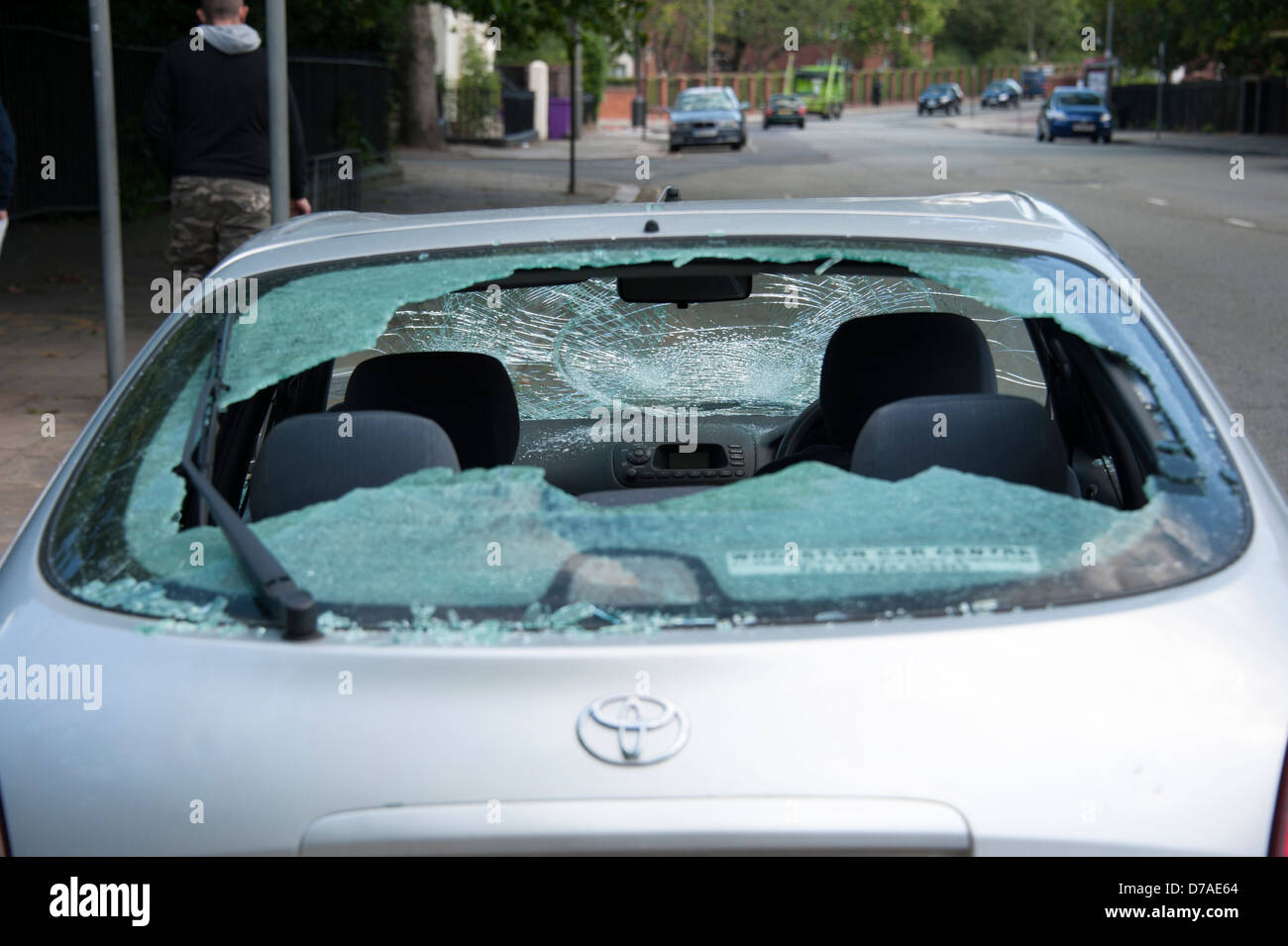 Smashed car windows after rioting criminal damage Stock Photo