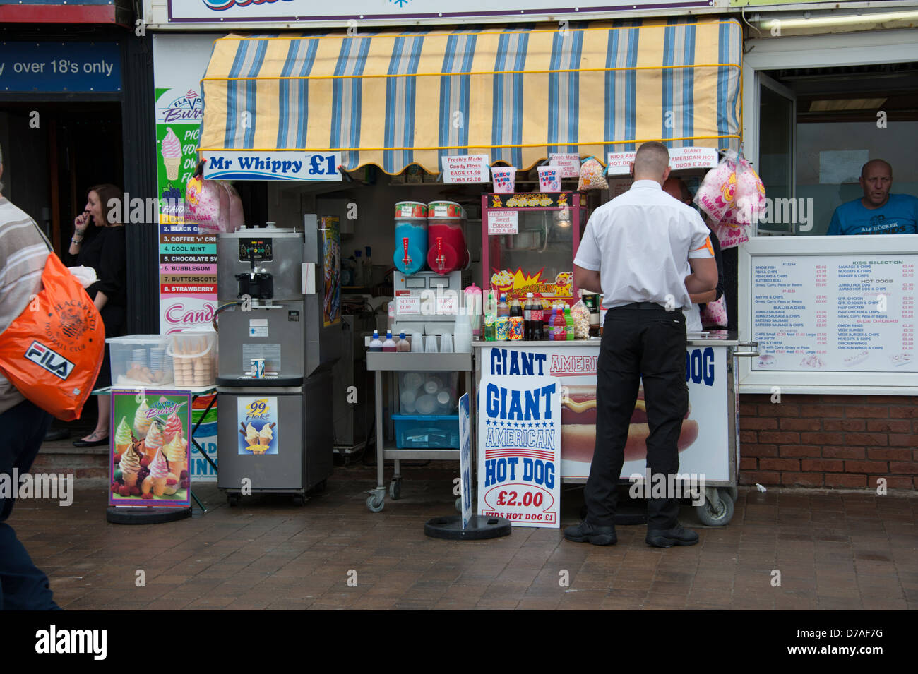 Club Bouncer buys candyfloss at shop in Blackpool Stock Photo