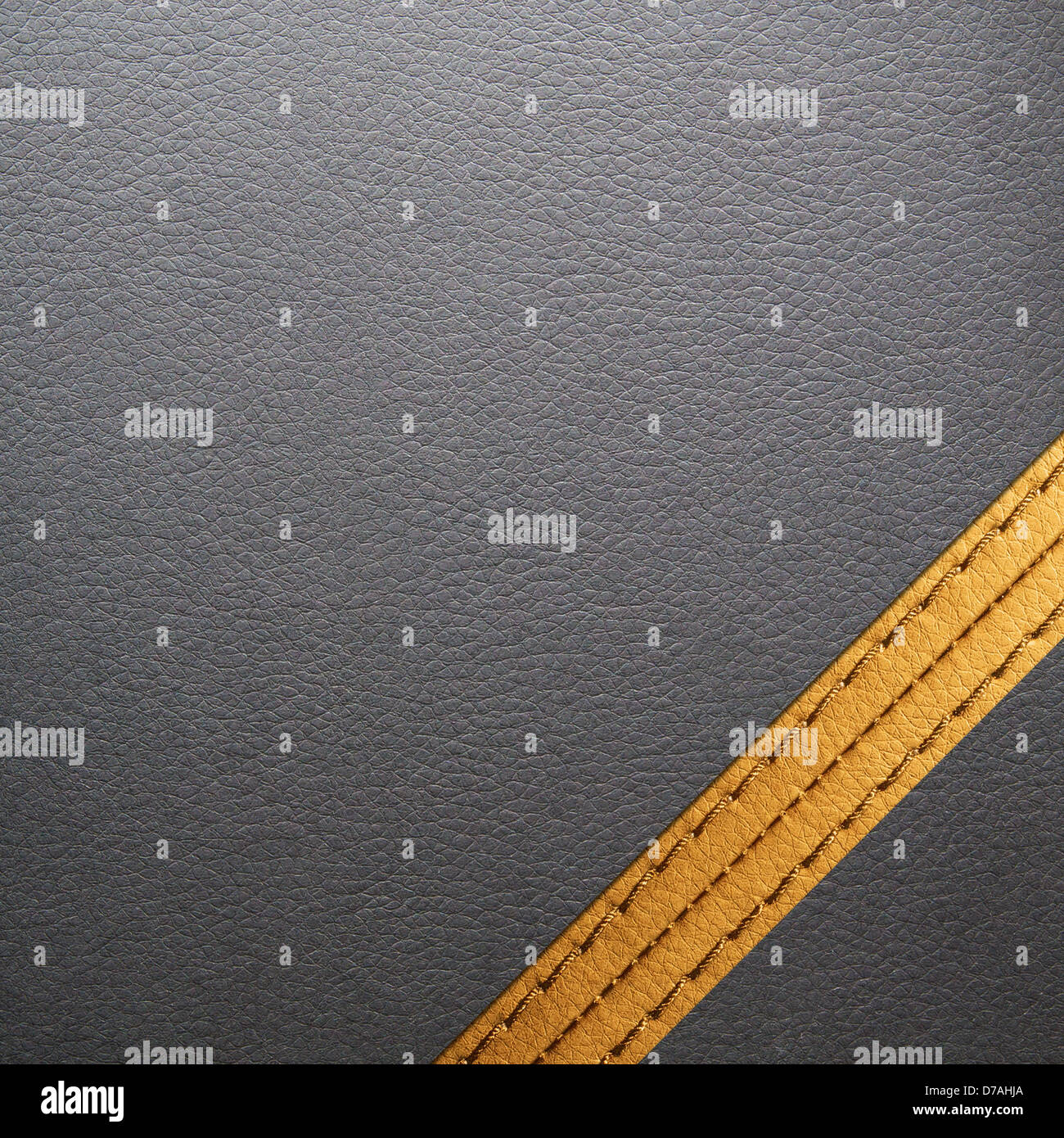 Black leather texture for background with yellow seam Stock Photo