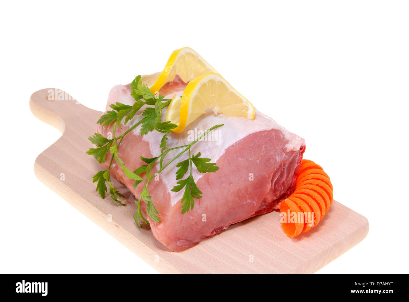 part of pork loin on desk-board isolated on white background Stock Photo