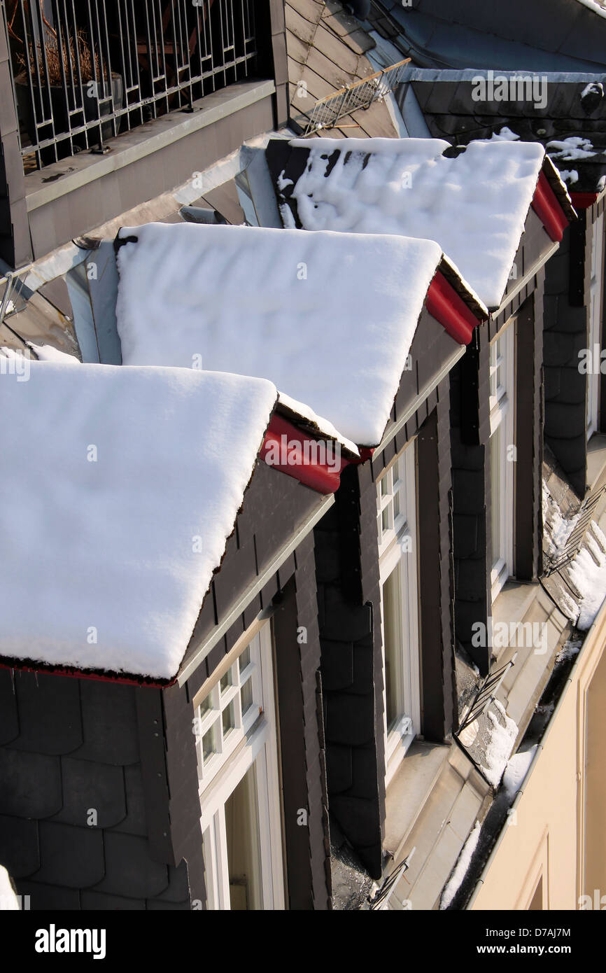 Snowy dormer windows at old building in Wiesbaden, Hesse, Germany Stock Photo