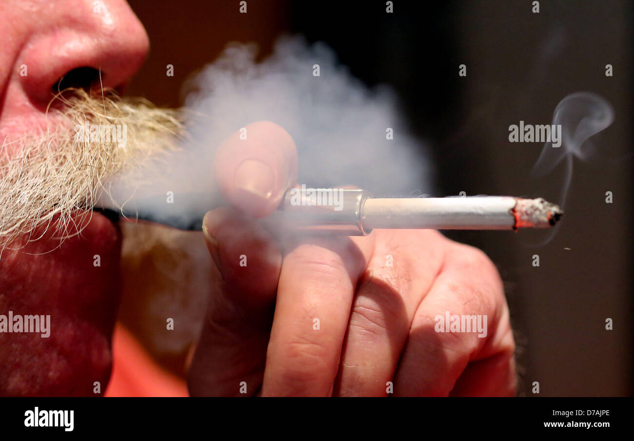 do germans smoke a lot of cigarettes A man smokes a cigarette in a bar in Cologne, Germany, 30 April 2013.  Starting on 01 May, tighter restrictions on smoking will take effect in the  German state of North Rhine-Westphalia