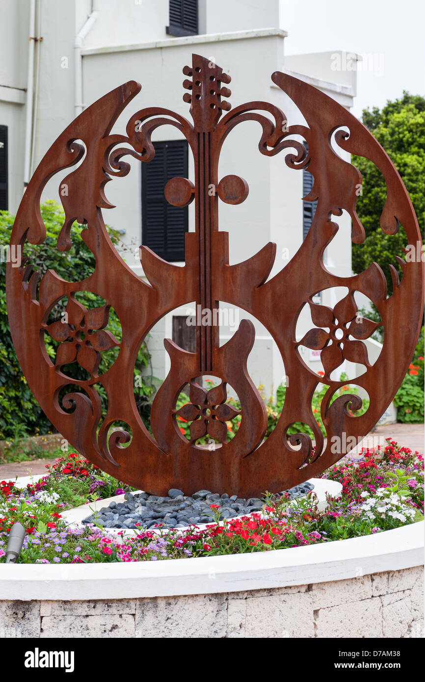 The John Lennon tribute sculpture named 'Double Fantasy' is outside the Masterworks Museum at the Bermuda Botanical Gardens. Stock Photo