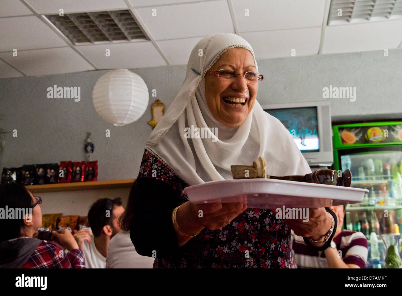 Rechaniya, Israel. 2nd May 2013. A Circassian woman in traditional dress serves coffee in a local restaurant. Rechaniya, Israel. 2-May-2013.  The Adyghe, Circassians or Cherkess, are a North Caucasian ethnic group, displaced in the Russian conquest of the Caucasus in the 19th century. Some 4,000 Sunni Muslim Circassians live in Israel in two northern villages of Kfar Kama and Rechaniya. Credit:  Nir Alon / Alamy Live News Stock Photo