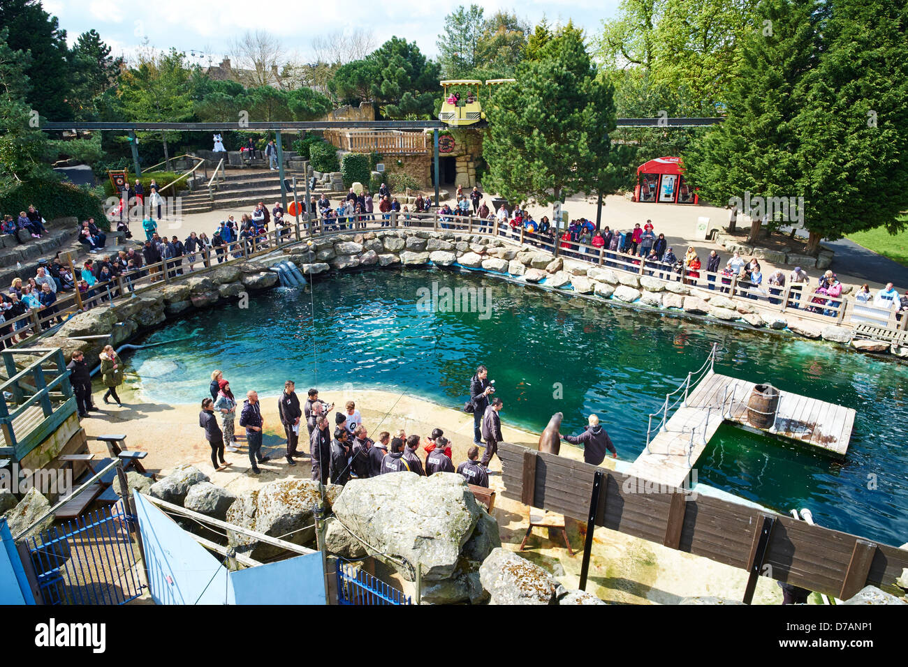 People watching the Sealion show within the zoo at Chessington World of Adventures Surrey UK Stock Photo