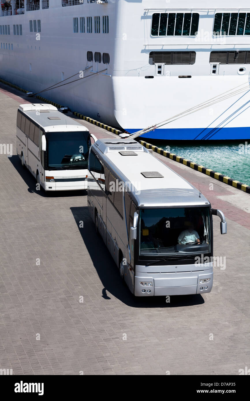 passenger bus two ship pier Stock Photo