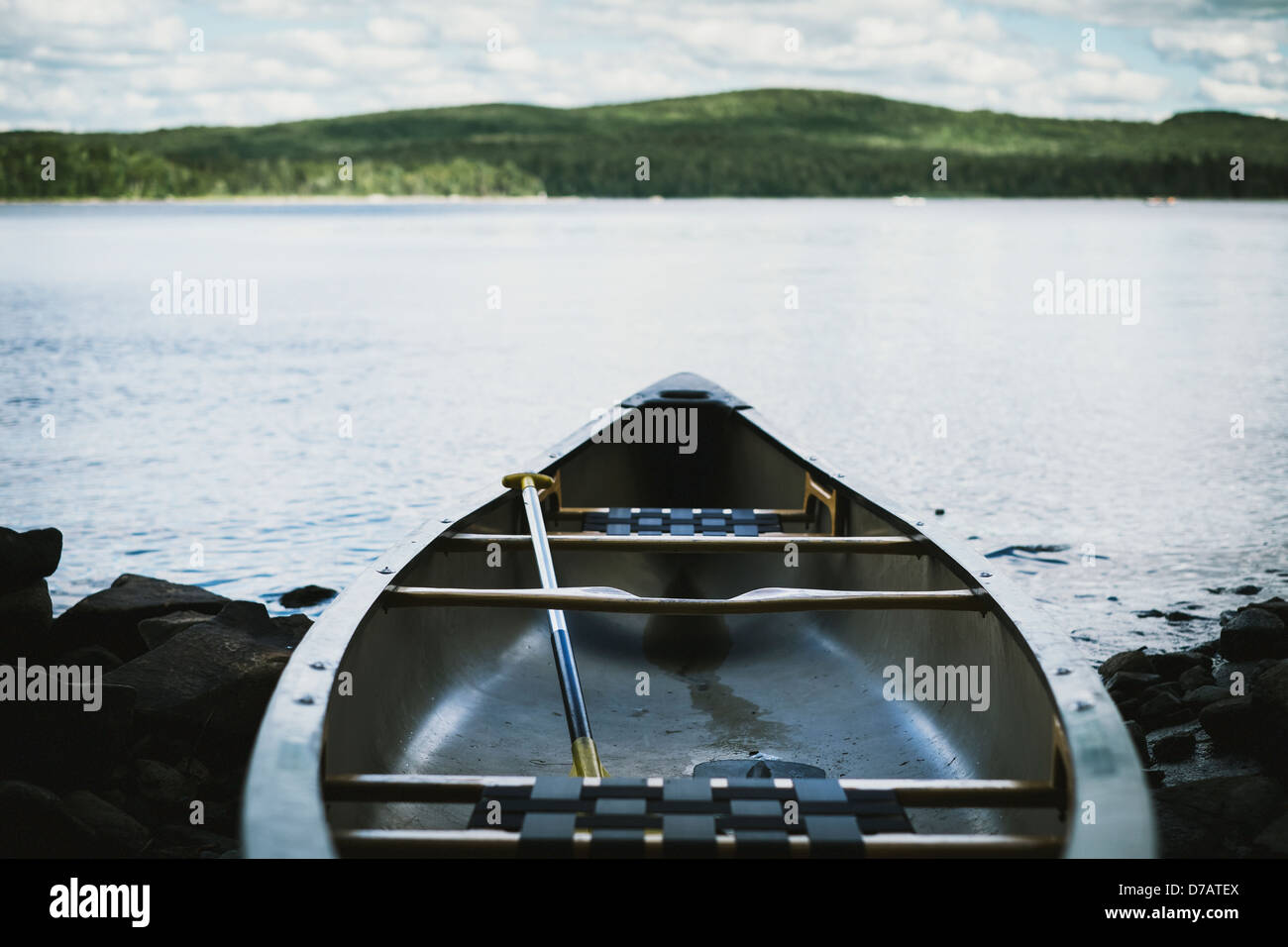 Fiberglass Canoe At Lakeside With Mountain On The Horizon;Thetford