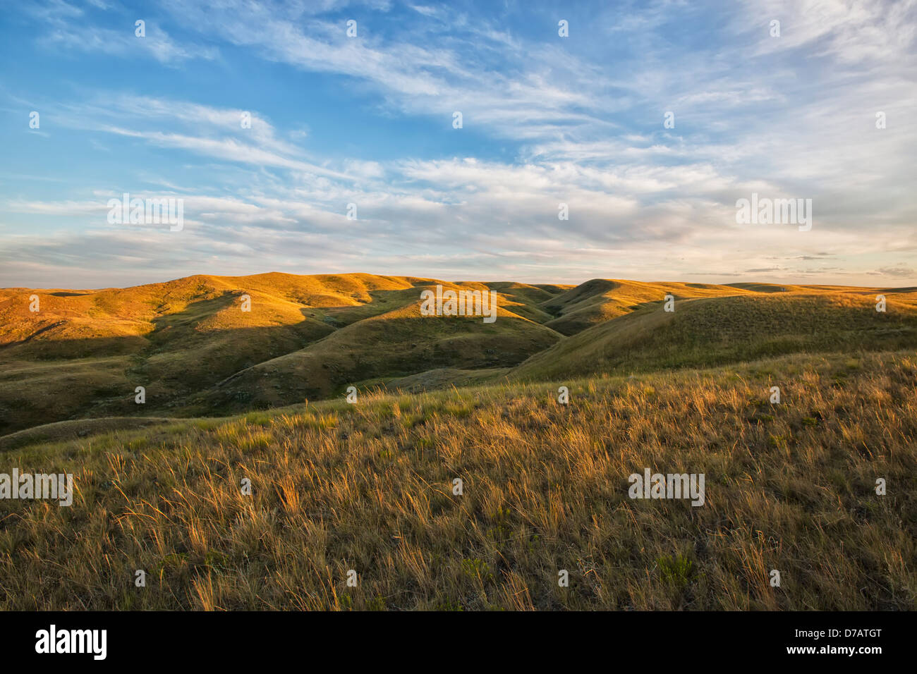 The Setting Sun Lights Up The Top Of The Coulees In Grasslands National Park;Saskatchewan Canada Stock Photo