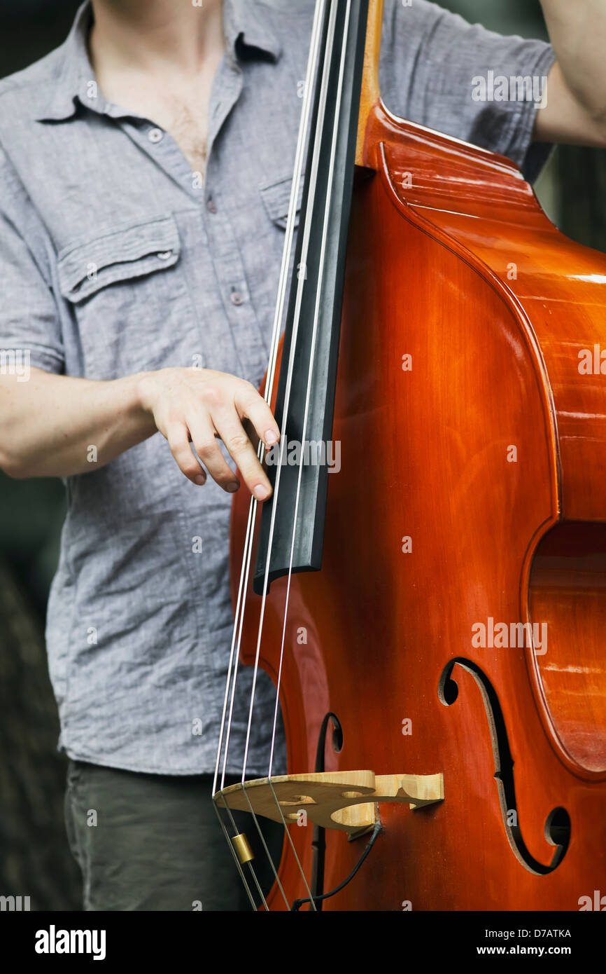 Jazz Musician Playing Bass; Winnipeg Manitoba Canada Stock Photo