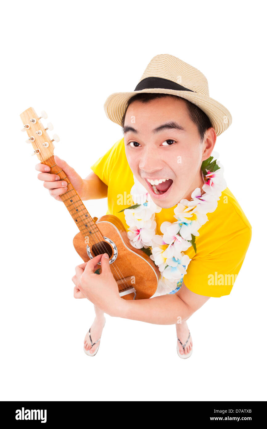 young man playing ukulele and singing Stock Photo