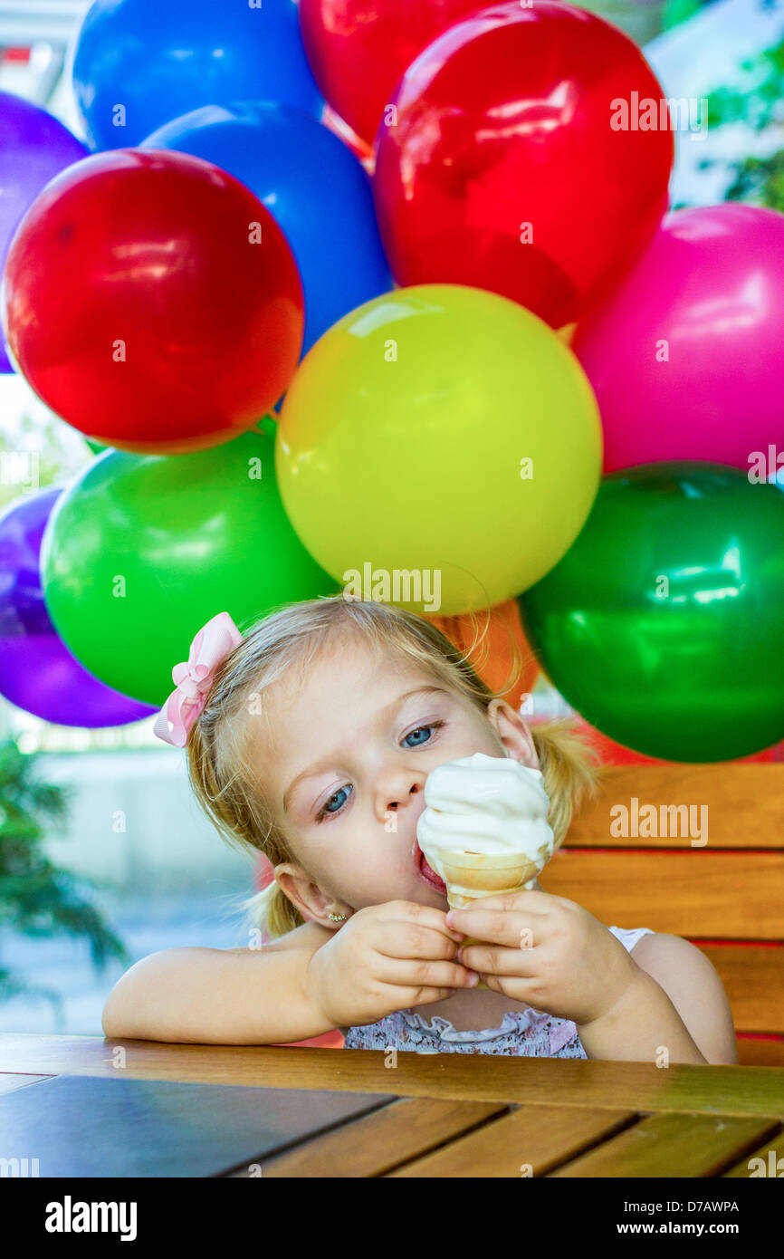 Little girl eating an ice cream Stock Photo