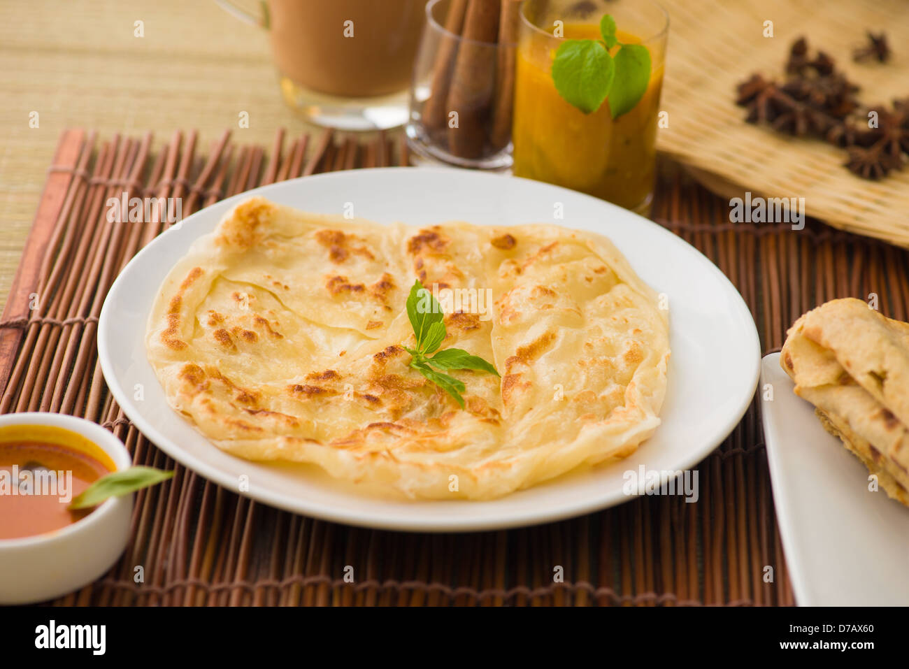 roti canai and teh tarik, very famous drink and food in malaysia Stock  Photo - Alamy