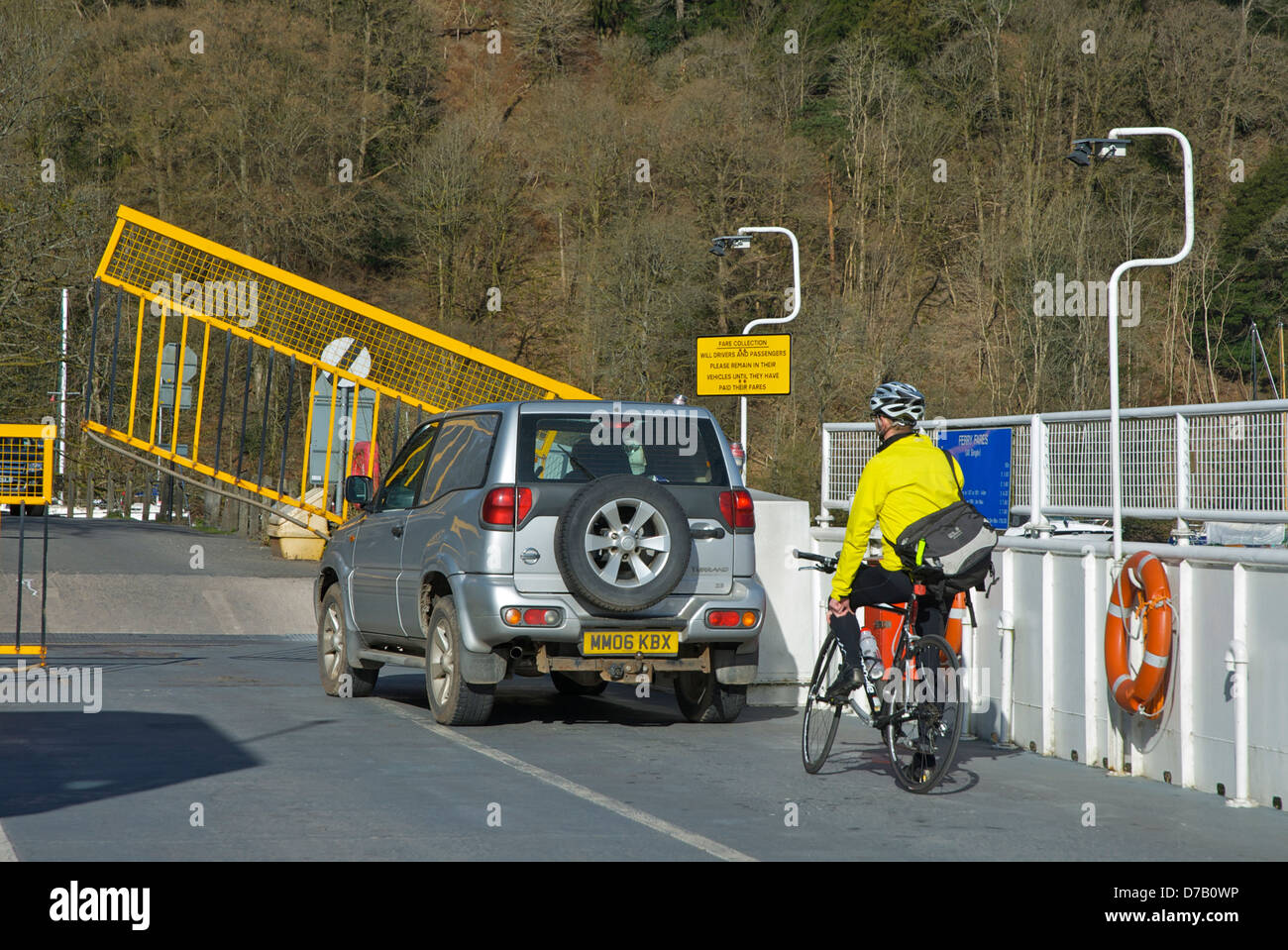 Car and cyclist on the Windermere car ferry, Lake District National