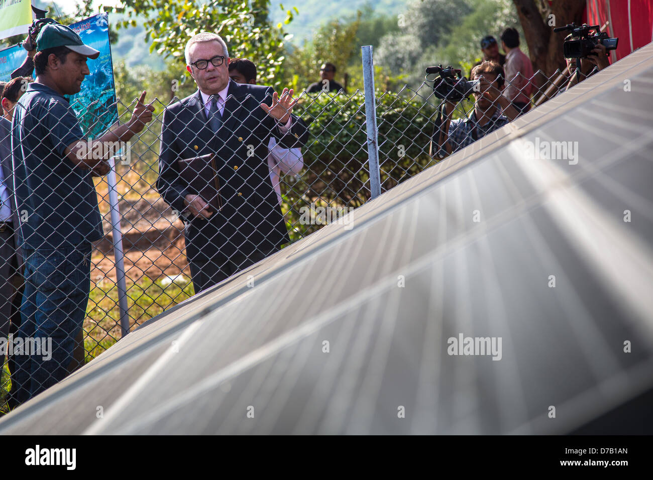 Ambassador Hoagland in front of a solar panel at a FAS/USDA project in Punjab Province, Pakistan Stock Photo