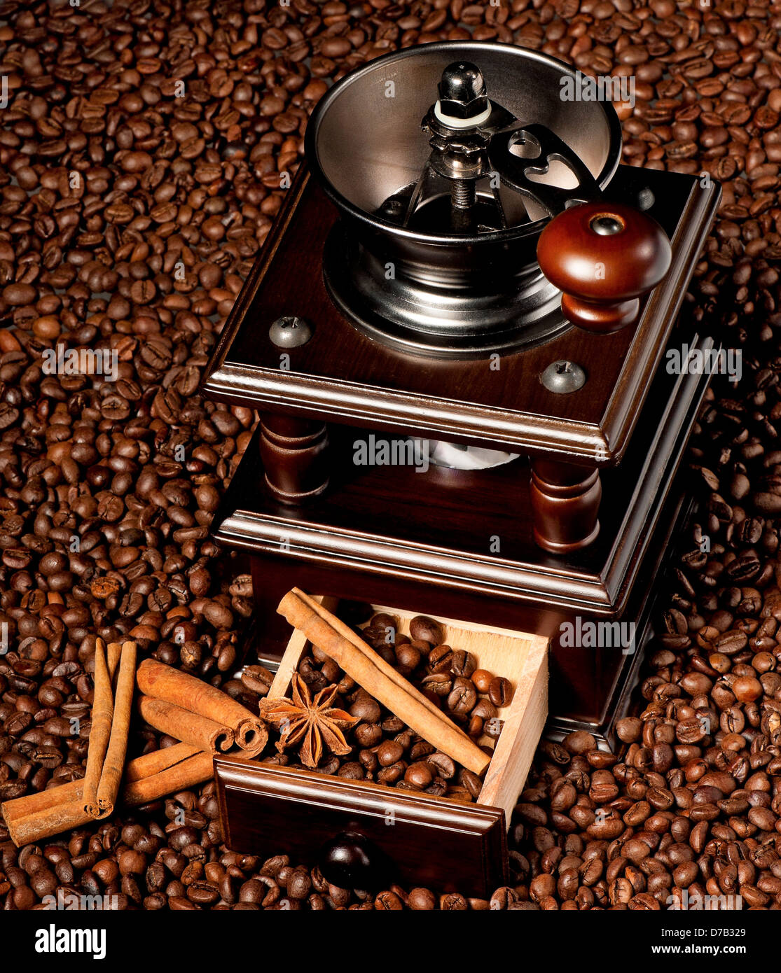 Vintage manual spice grinder on wooden background Stock Photo - Alamy