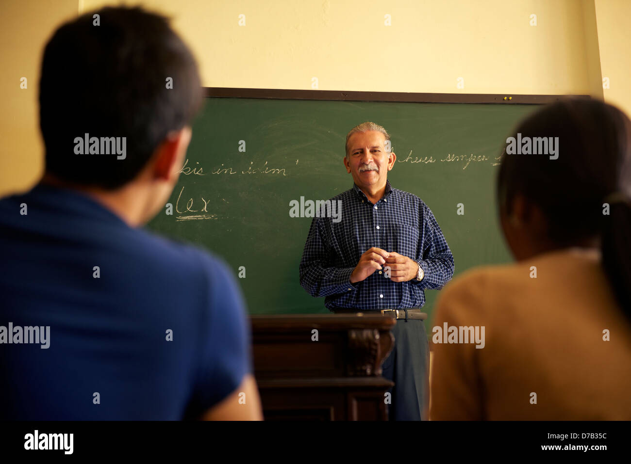 People and education, professor talking to students during lesson in college, Law School, University of Havana, Cuba Stock Photo