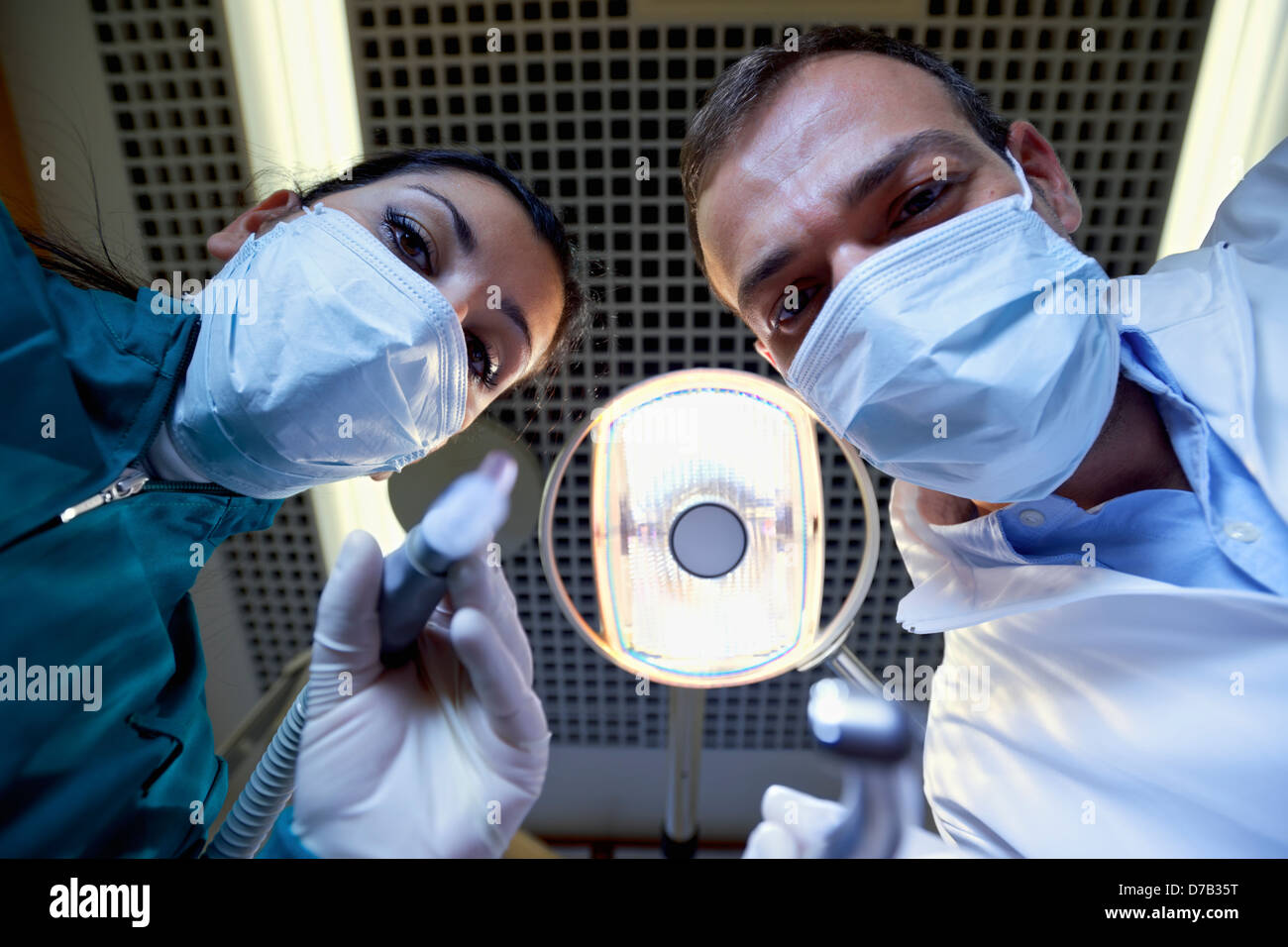 Medical personnel and staff at work in dental clinic, dentist and
