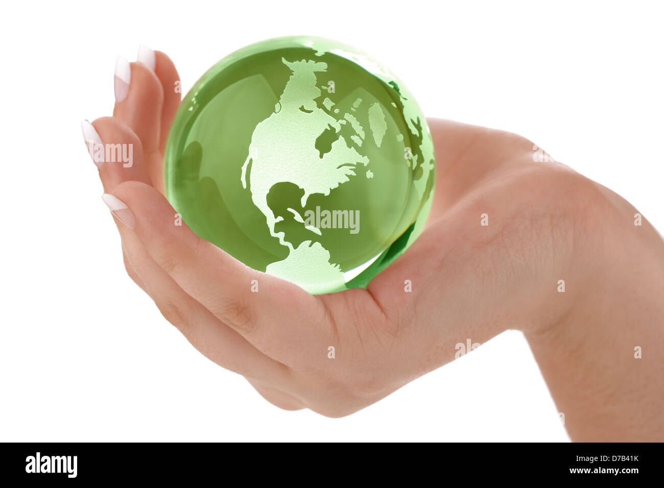 Green globe in female hand Stock Photo