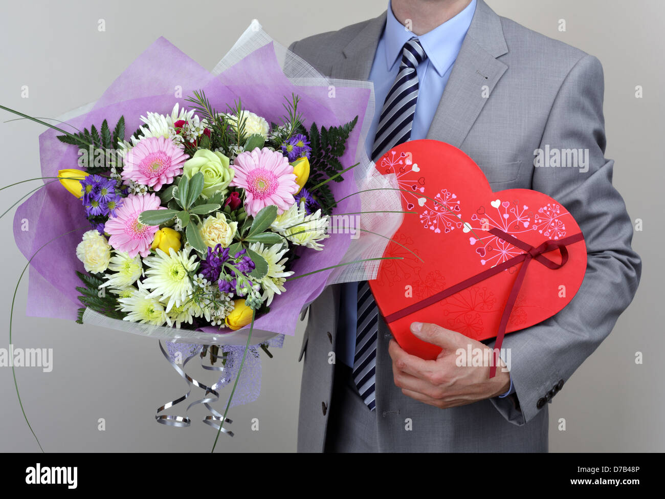 Bouquet of flowers and box of chocolates Stock Photo