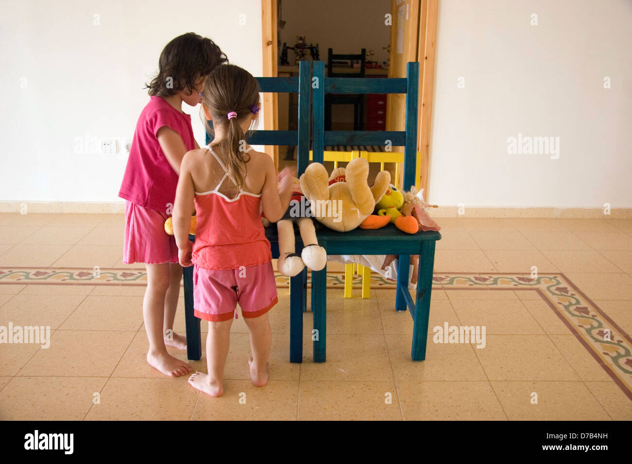 girls playing with dolls Stock Photo