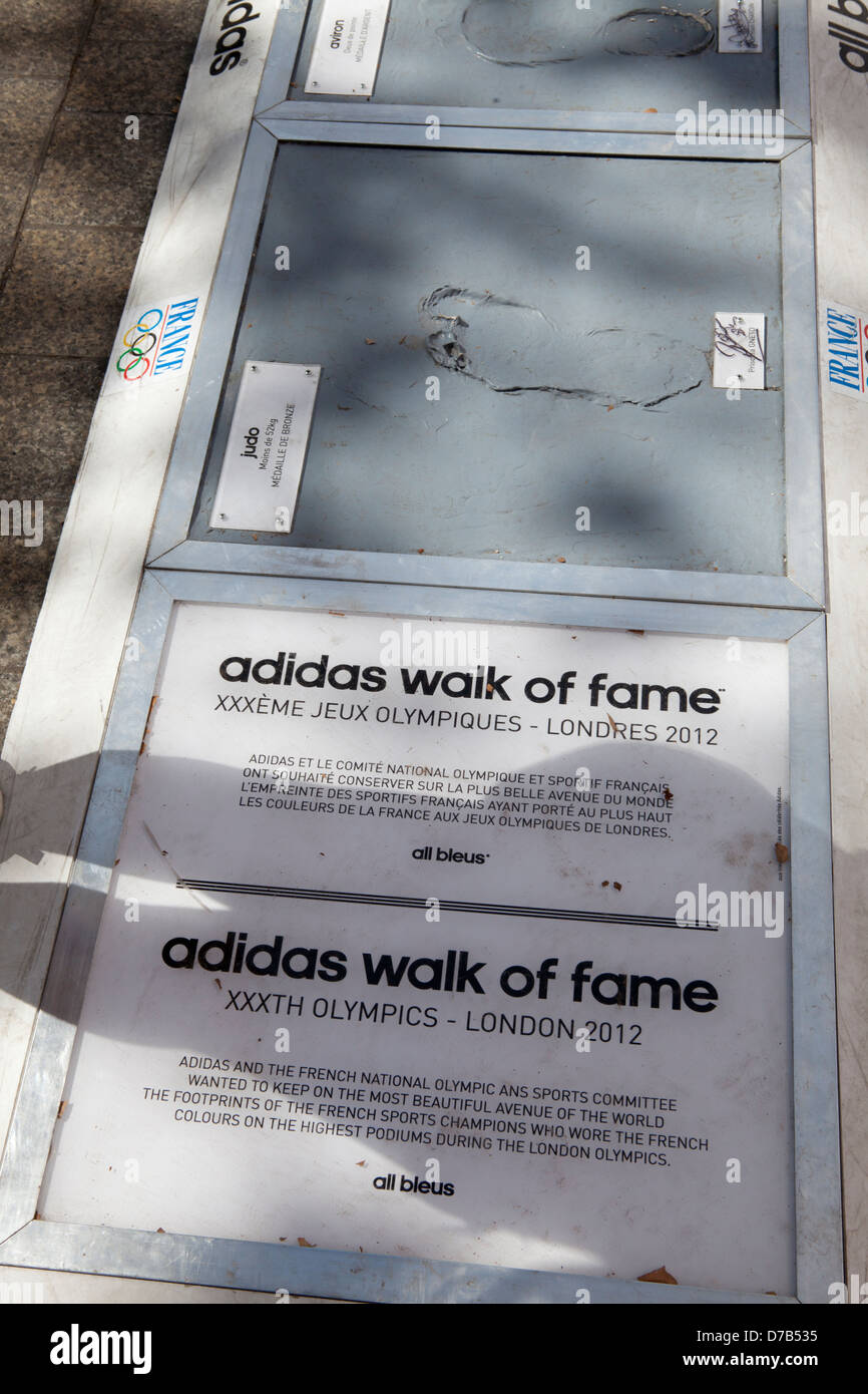 Adidas walk of fame on Champs Elysees in Paris.Olympic athletes feet prints  in concrete. France Stock Photo - Alamy