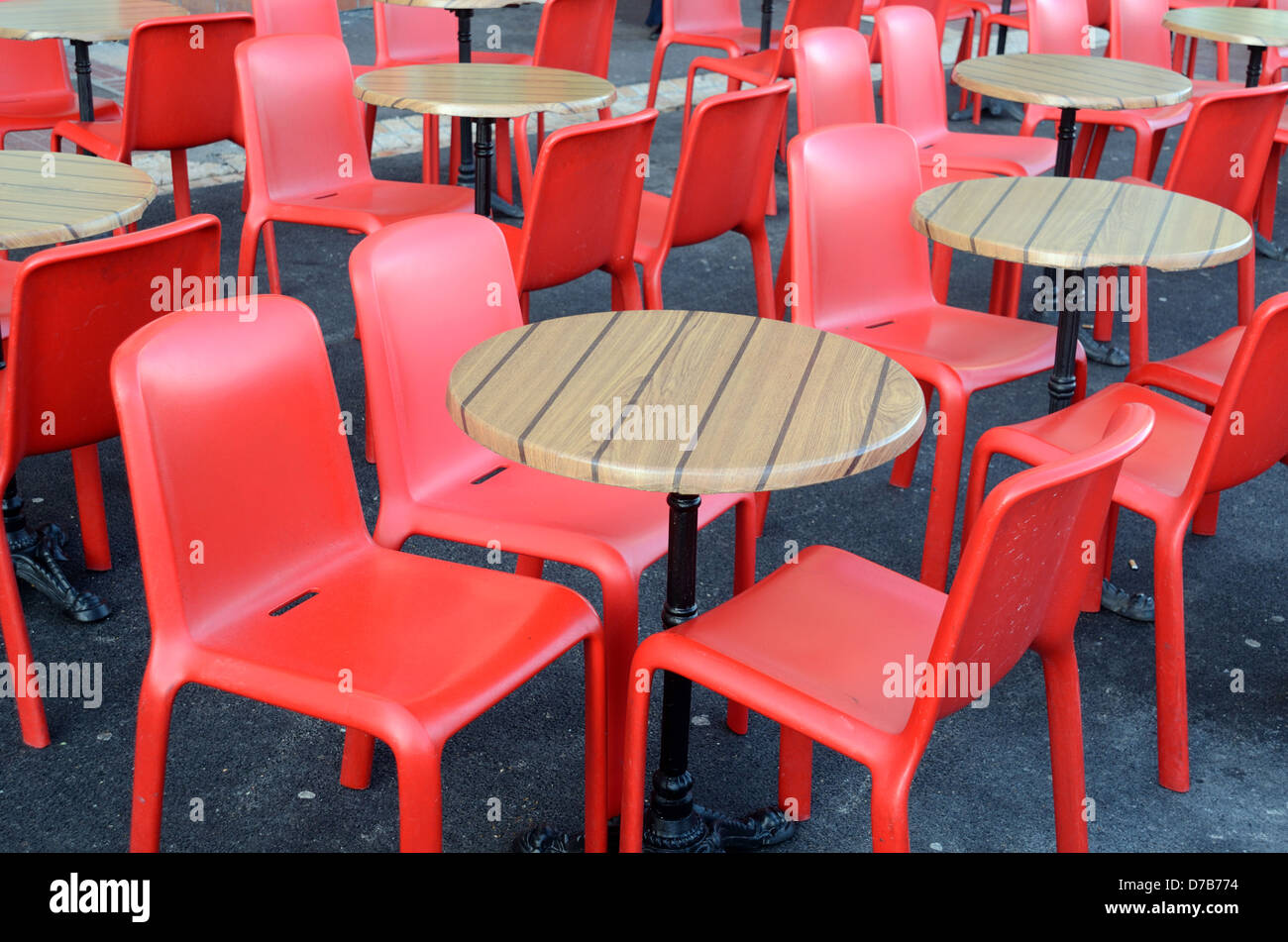 Empty Red Plastic Chairs and Tables Outside Deserted Irish Pub Old Port or Vieux Port Marseille Provence France Stock Photo