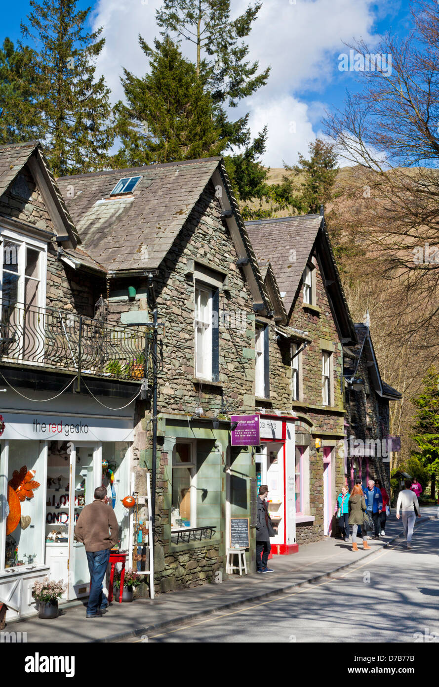 Tourists wandering around Grasmere Village with shops and cafes Cumbria Lake District England UK GB EU Europe Stock Photo