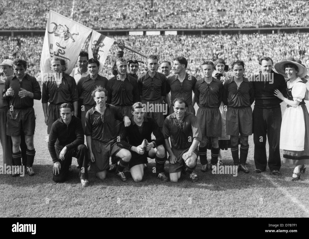 The team of 1. FC Kaiserslautern wins the German Championship on the 21st  of June in 1953 against VfB Stuttgart with 4:1. National players Fritz  Walter und Werner Liebrich (standing, from left),