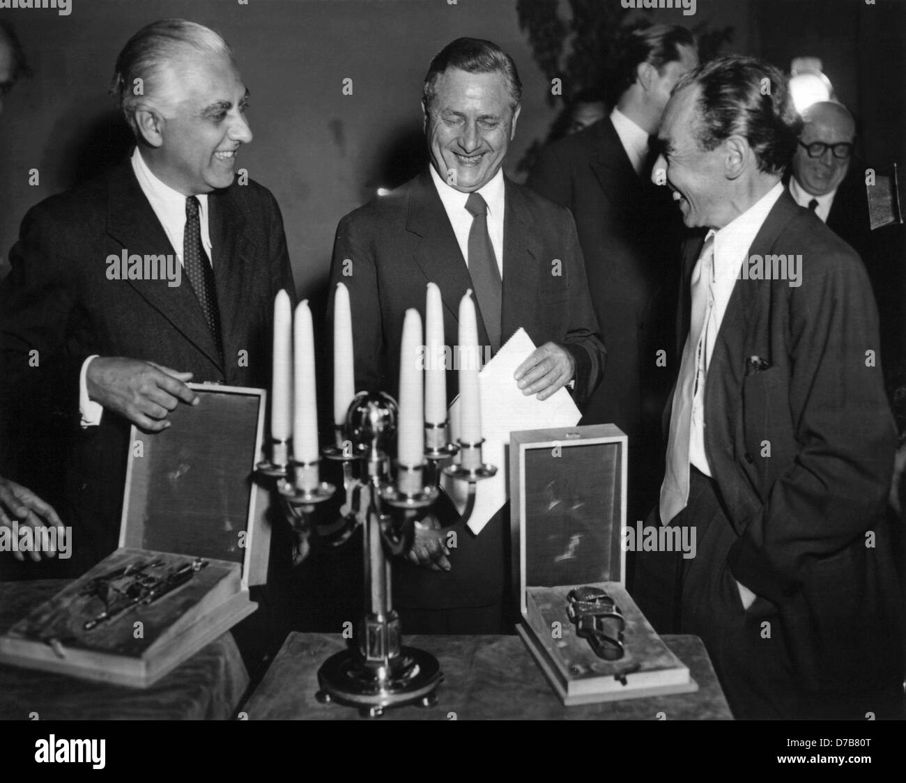 Director Josef von Baky (l), producer Günter Stapenhorst (M) and screenplay writer Erich Kästner (r) are happy about their awards for the film 'Lottie and Lisa' on the 7th of June in 1951 at the Federal Film Award Ceremony in Berlin. The German Film Award was awarded for the second time in 1951. Stock Photo