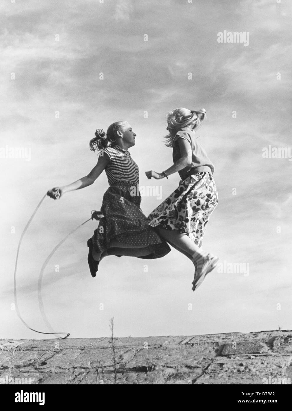 Synchronized skipping with a skipping rope in the 1950s Stock Photo Alamy