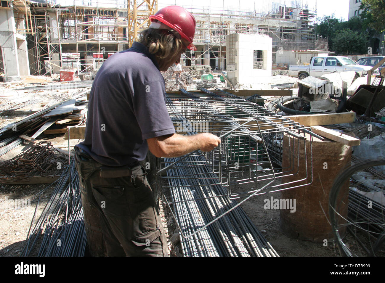 iron bender working at construction in tel aviv Stock Photo