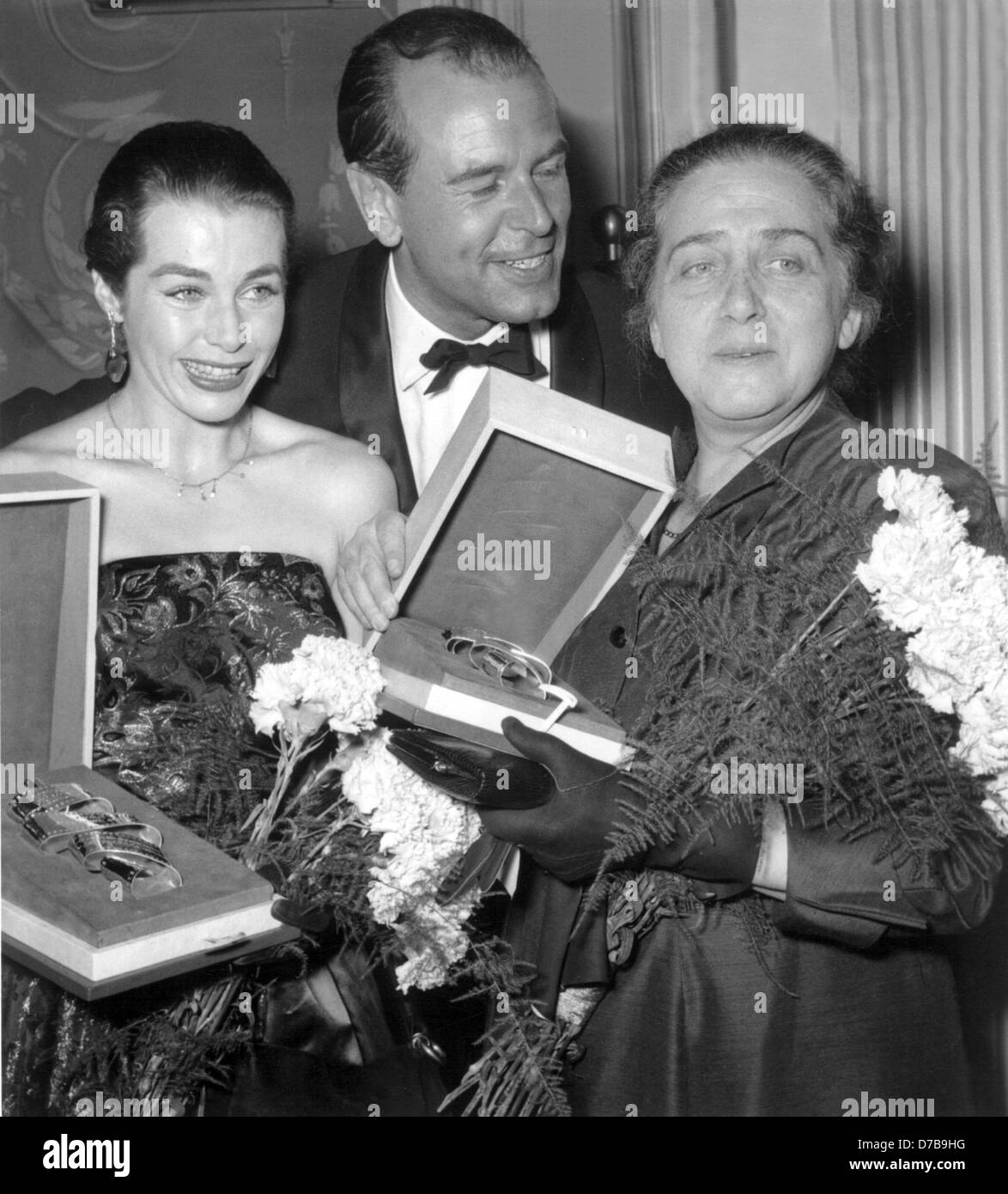 Marianne Koch, O.W. Fischer and Therese Giehse (l-r) receive the Silver Tape during the International Film Festival 1955 in Berlin. Stock Photo