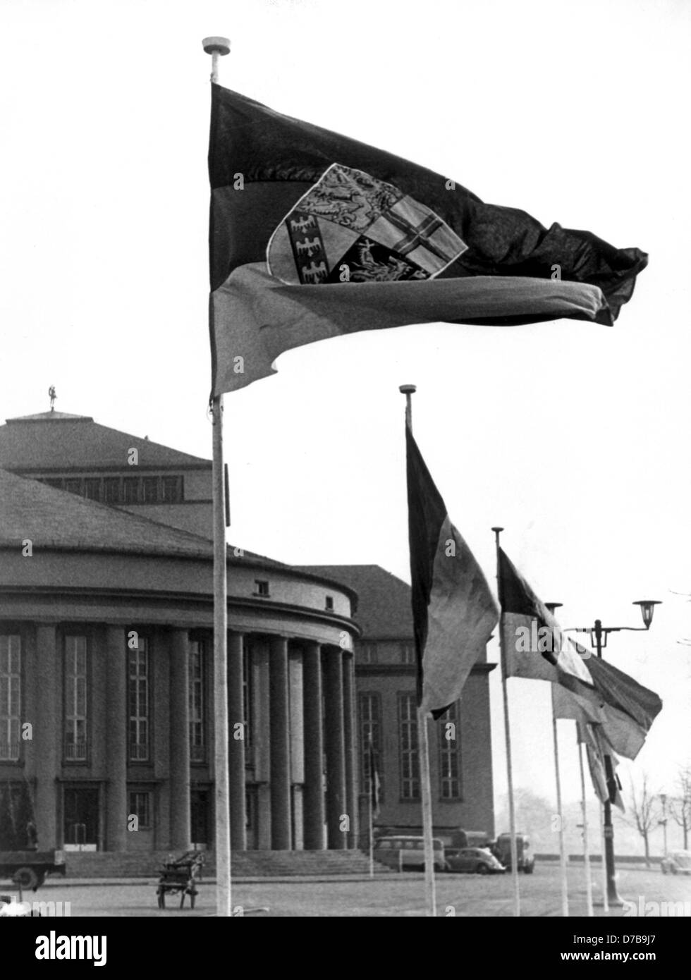 German flags in front of the state theatre in Saarbruecken on the occasion of the integration of the Saarland in 1957. Stock Photo