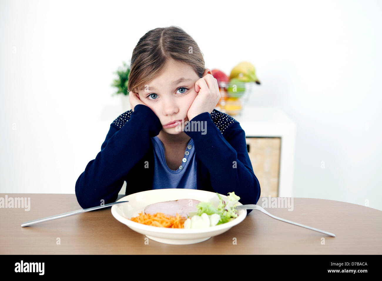 CHILD EATING A MEAL Stock Photo