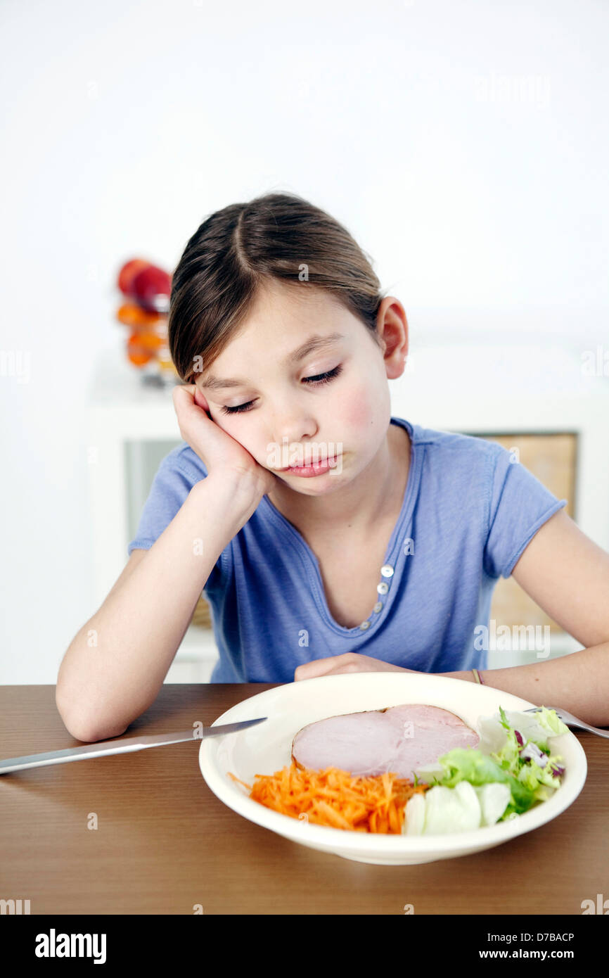 CHILD EATING A MEAL Stock Photo