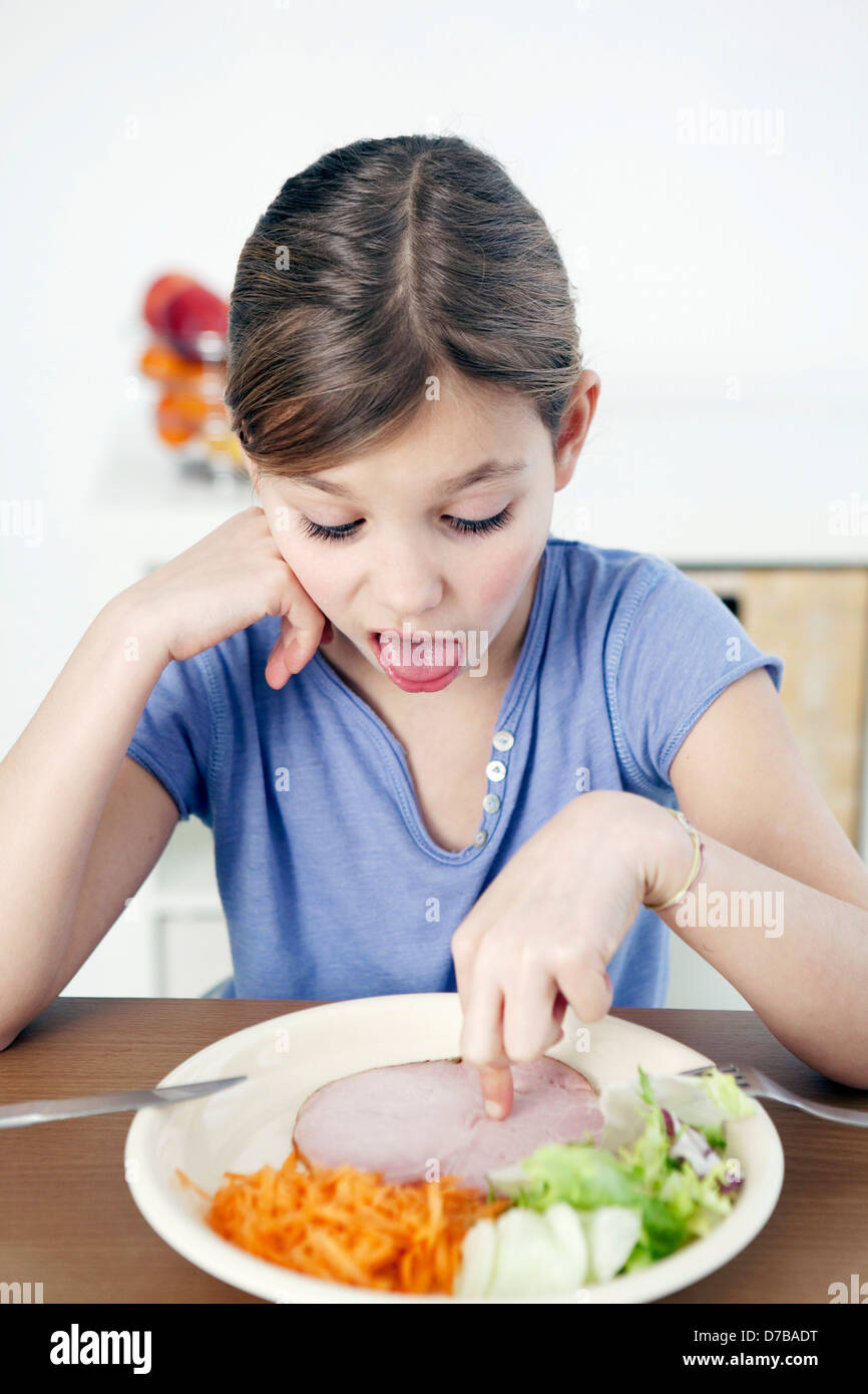 CHILD EATING A MEAL Stock Photo