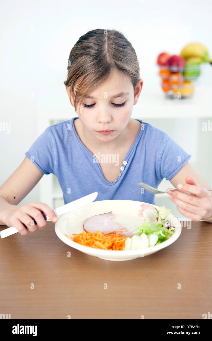 CHILD EATING A MEAL Stock Photo