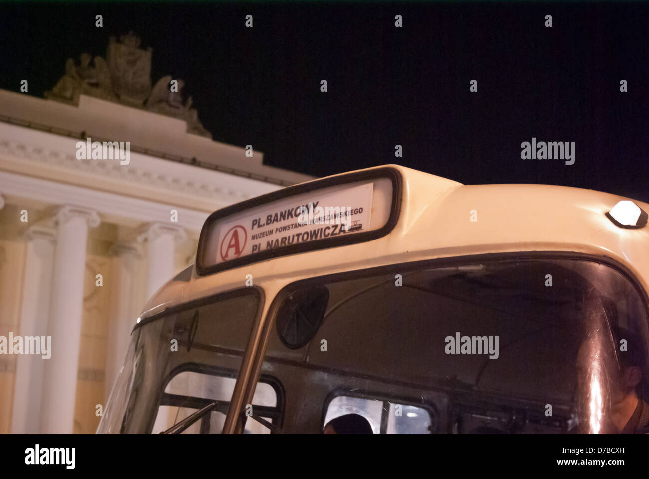 Vintage city bus (detail) near Warsaw City Hall with Warsaw coat of arm visible in bg, taken in the night Plac Bankowy, Warsaw Stock Photo