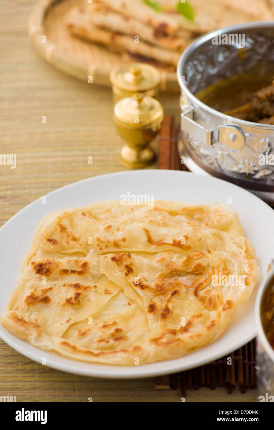 roti canai flat bread, very famous mamak food in malaysia, usually served wtih curry sambal or sugar Stock Photo