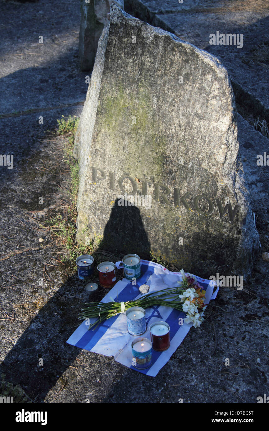 Israeli flag and memorial candles commemorating the Jewish holocaust victims at Treblinka extermination camp in Poland Stock Photo