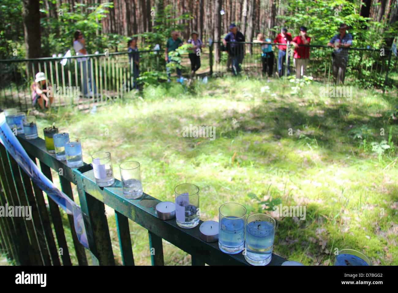 Memorial candles common grave Lopochova Forest Poland where Jews slaughtered Known Tykocin Massacre Stock Photo
