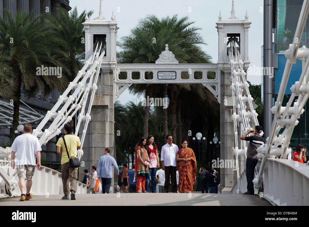 The venerable Cavenagh Bridge crosses the Singapore River in central Singapore. Stock Photo