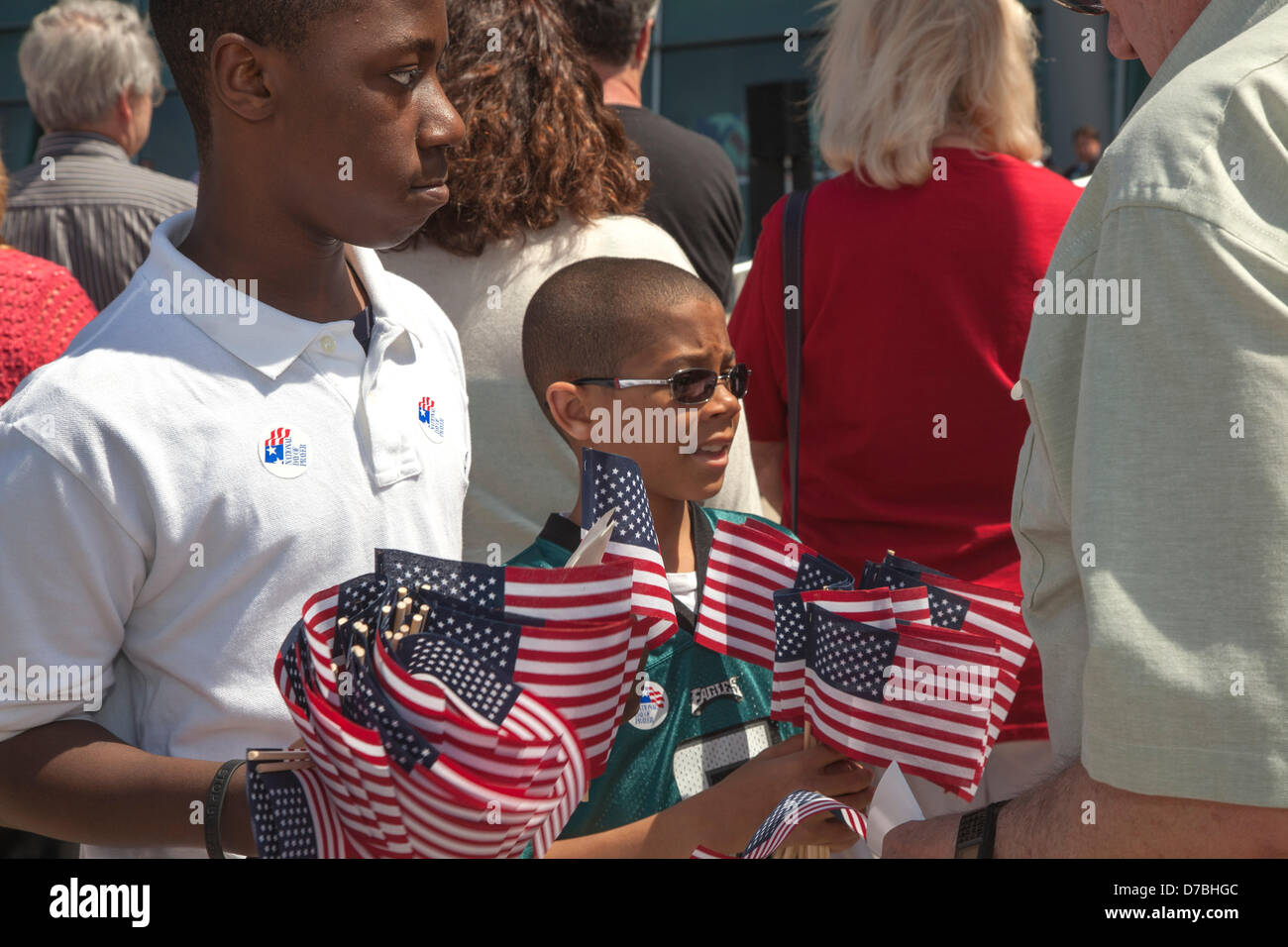 Warren, Michigan, USA. Boys hand out American flags during the annual National Day of Prayer observance at city hall. Credit:  Jim West / Alamy Live News Stock Photo