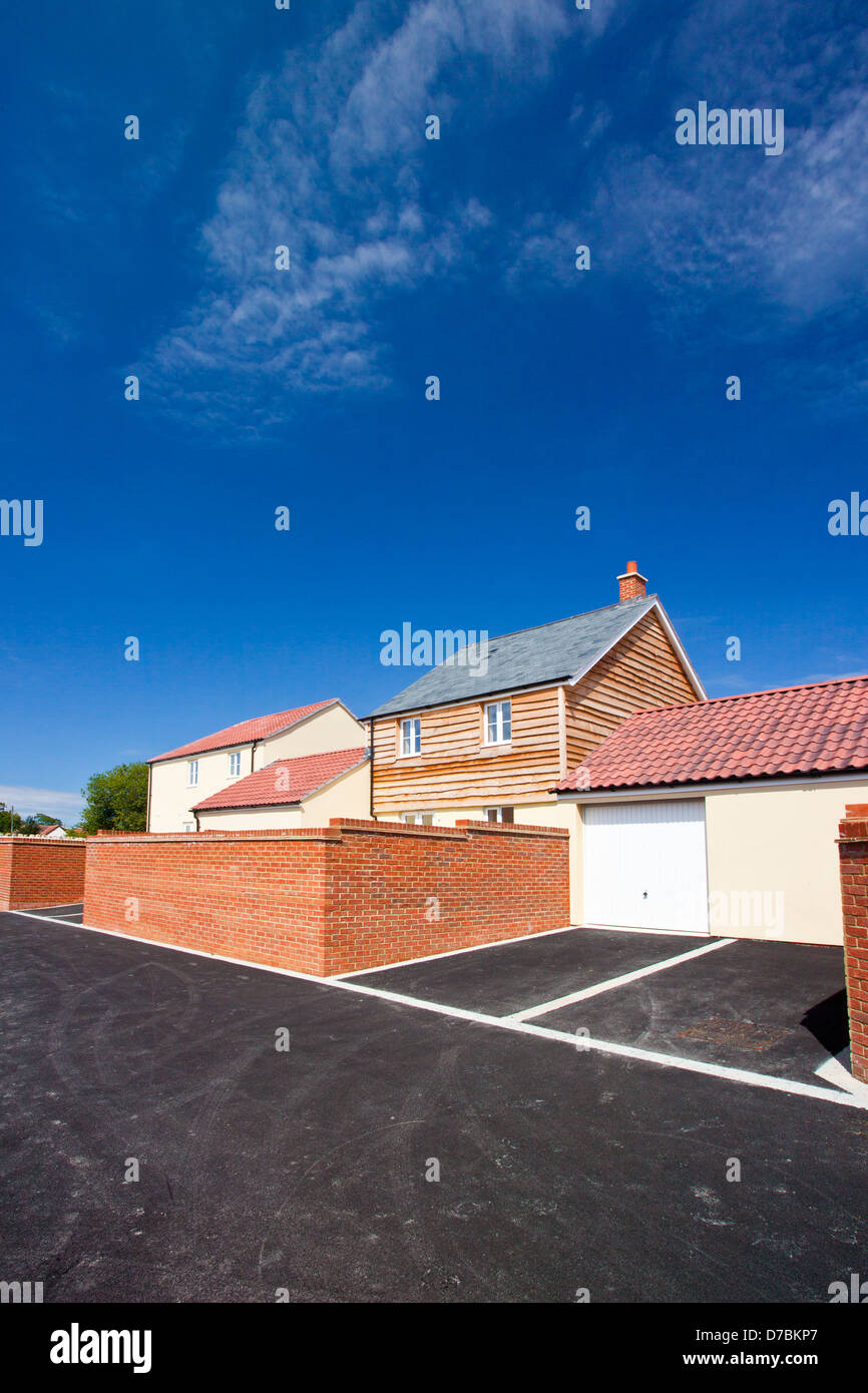An estate of new build houses in the style and colours of traditional