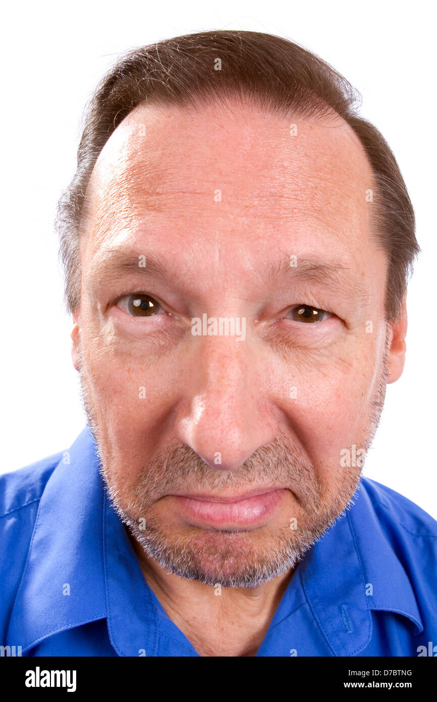 Cocky and brash senior adult man poses with a self-confident smug look and attitude. Stock Photo