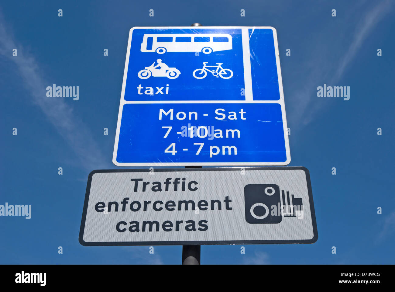 british road signs indicating traffic enforcement cameras and taxi, cycle and bus lane restrictions Stock Photo