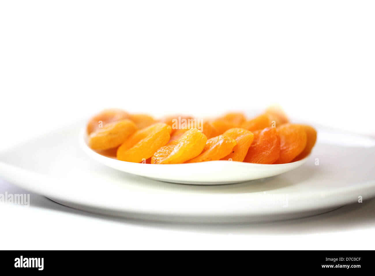 dried apricots isolated on white background Stock Photo - Alamy