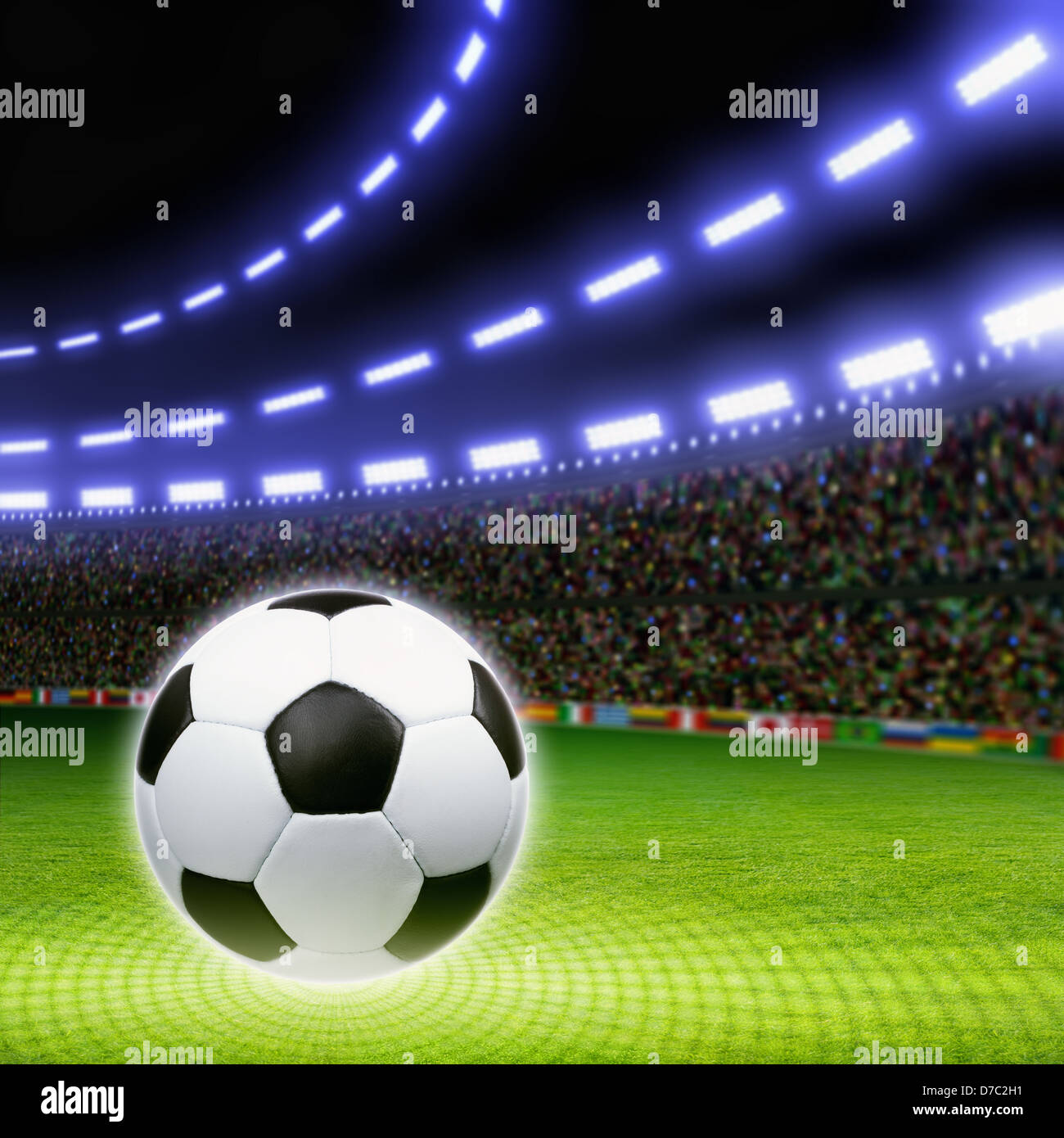 Soccer ball on green stadium, arena in night illuminated bright