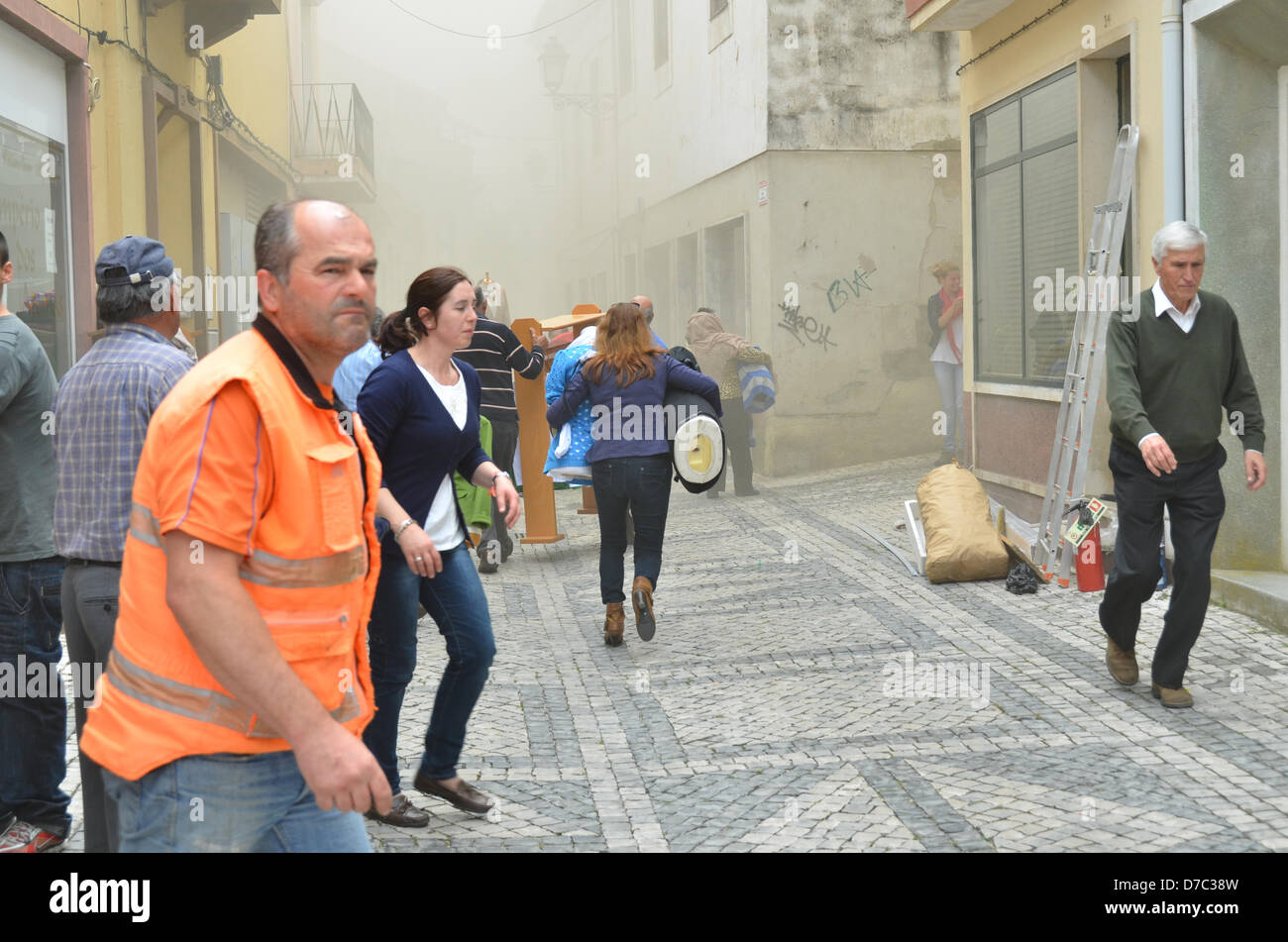 Rio Maior, Portugal , 03 May 2013. A fire flag in a shop . People help to remove what they can shop interior Credit:  Bruno Monico / Alamy Live News Stock Photo