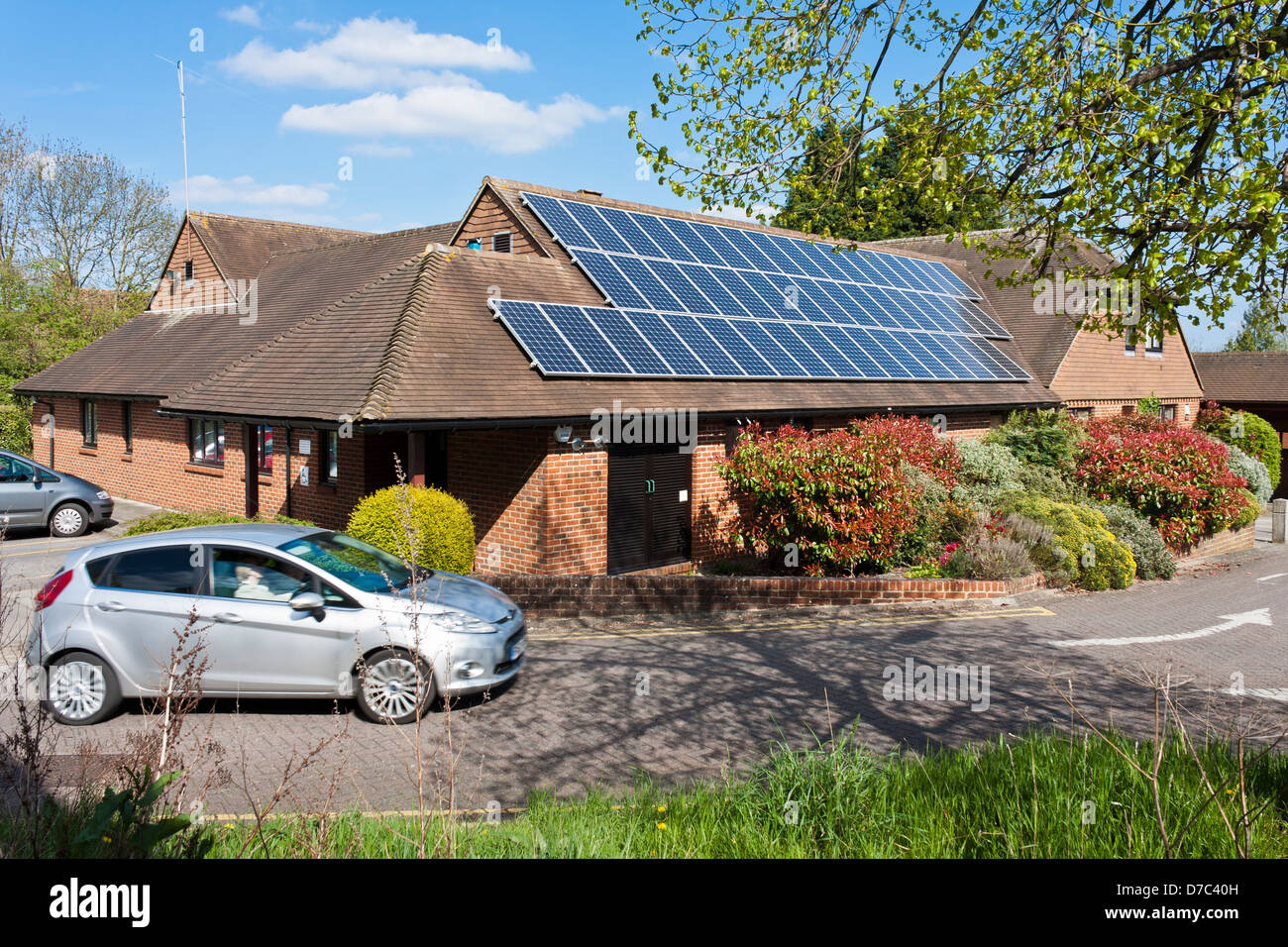 Solar panels fitted to the roof of a NHS GP surgery Reading, Berkshire, England, GB, UK. Stock Photo
